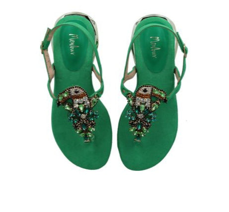 Green toucan flip flops