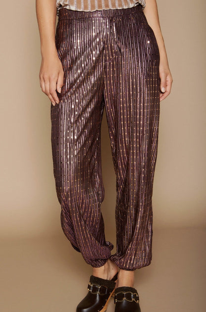 Wide trousers with shiny pleats